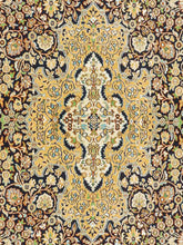 Load image into Gallery viewer, Close up shot of a Kashmiri Carpet made in India with intricate vines and flowers knitted on a handknotted rug.
