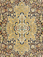 Load image into Gallery viewer, Close up shot of a Kashmiri Carpet made in India with intricate vines and flowers knitted on a handknotted rug.