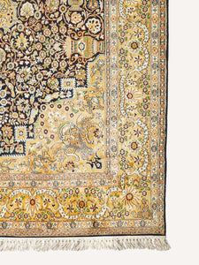 Corner shot of a Yellow Golden Silk kashmiri carpets.