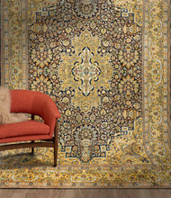 Load image into Gallery viewer, Full shot of a yellow golden kashmiri carpet hung on a wall in a room.