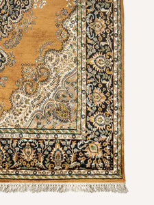 Corner shot of a botemir design hand knotted Indian carpet also known as a oriental rug.