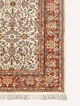 Load image into Gallery viewer, Corner shot of a traditional design hand knotted Indian carpet also known as a oriental rug.
