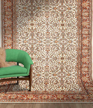 Load image into Gallery viewer, Full shot of a traditional design hand knotted Indian carpet also known as a oriental rug, in a room setting.
