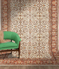 Load image into Gallery viewer, Full shot of a traditional design hand knotted Indian carpet also known as a oriental rug, in a room setting.