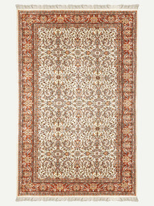 Full shot of a traditional design hand knotted Indian carpet also known as a oriental rug.