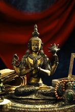 Load image into Gallery viewer, Bronze buddha statue of a seated buddha with outstretched hands on a dark background
