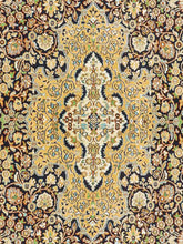 Load image into Gallery viewer, Close up shot of a Kashmiri Carpet made in India with intricate vines and flowers knitted on a handknotted rug.
