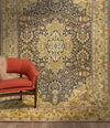 Full shot of a yellow golden kashmiri carpet hung on a wall in a room.