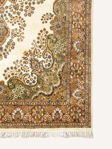 Corner shot of a traditional design hand knotted Indian carpet also known as a oriental rug.